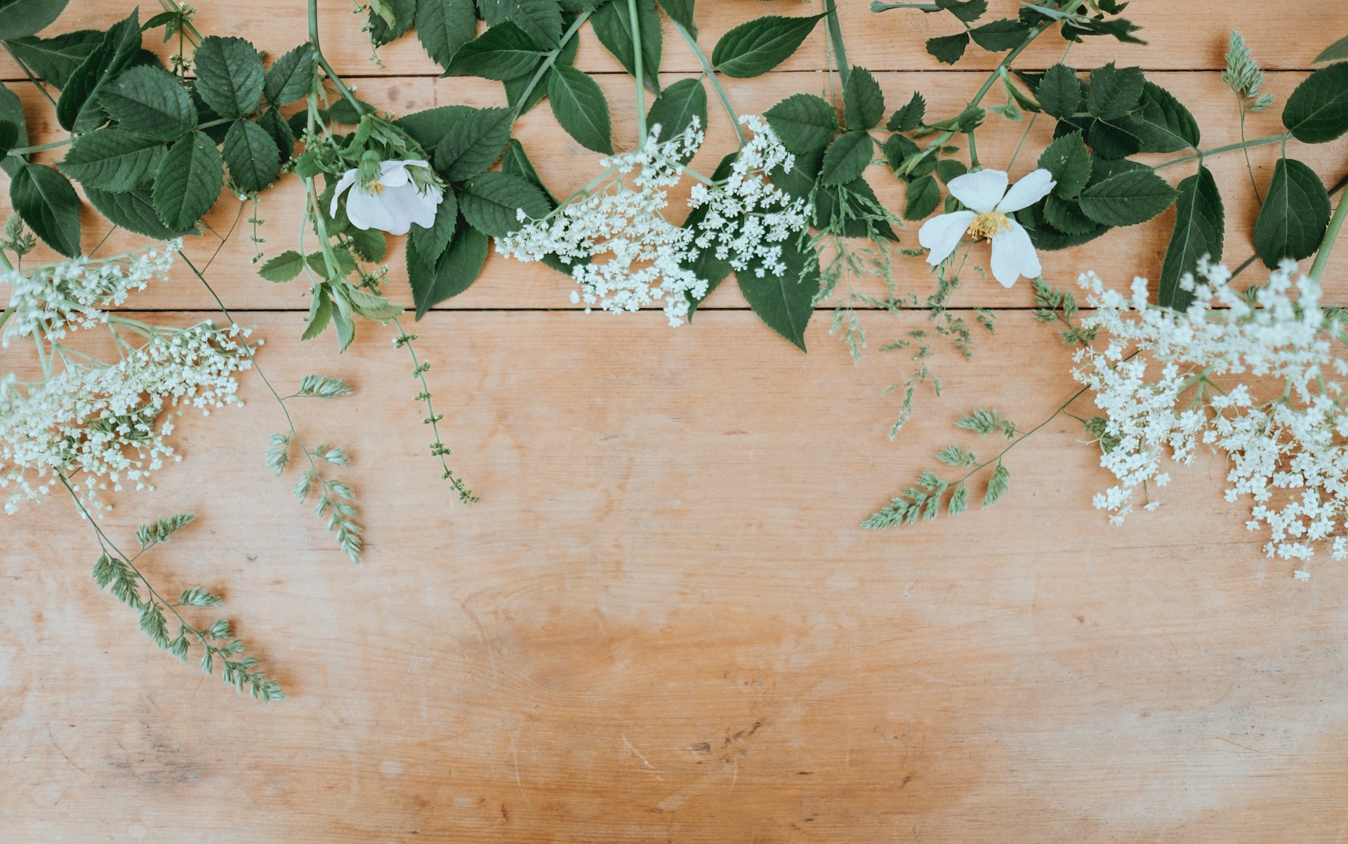 flowers placed on table made of wood