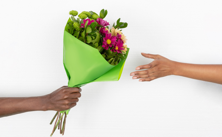 giving flowers hand in hand