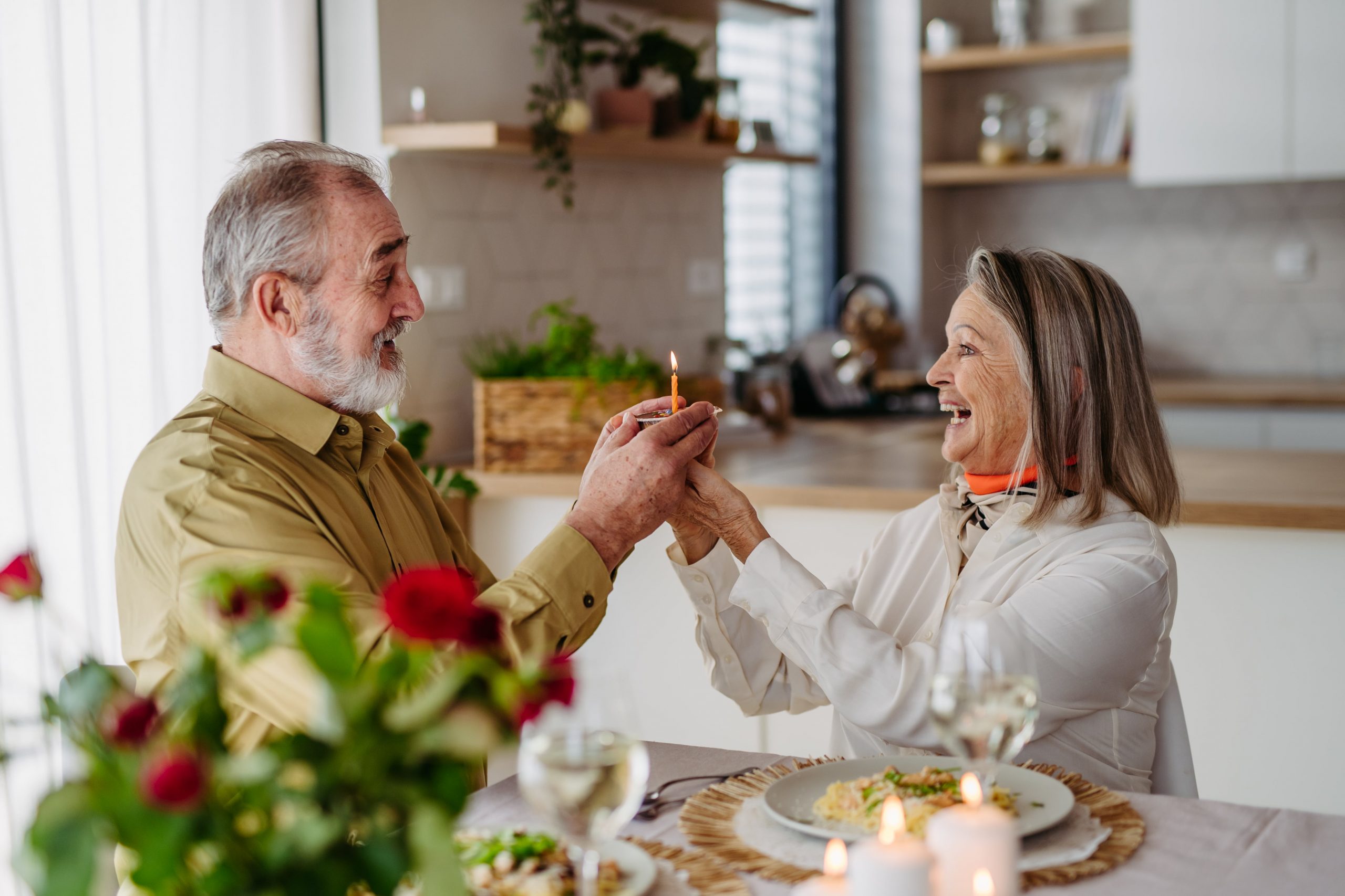 Couple celebrating an anniversary with flowers