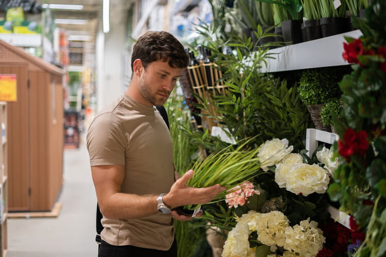 Person choosing flowers for a thoughtful gift